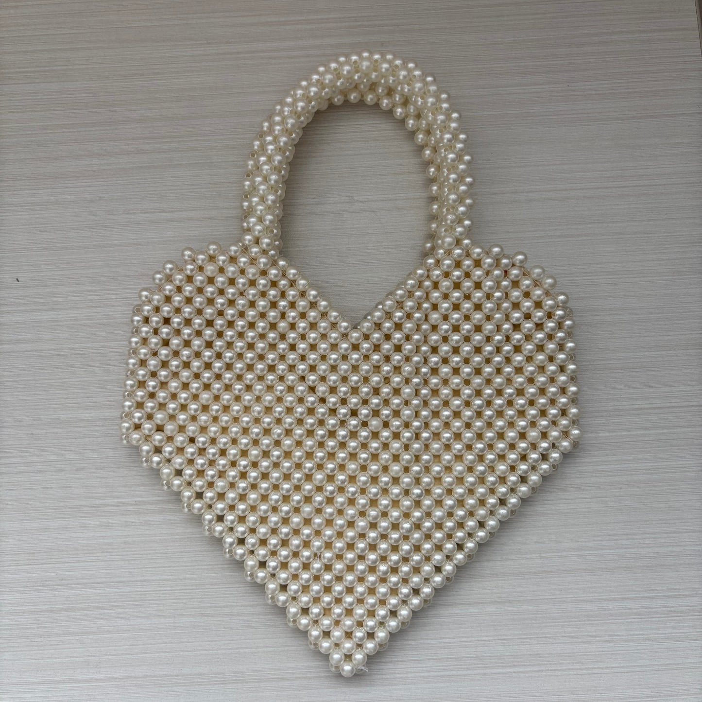Bolso corazón de perlas